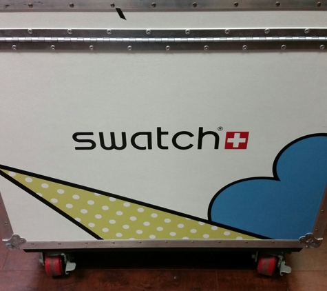 My Creative Pros - Sherman Oaks, CA. Die Cut Vinyl on Swatch Anvil Cases used to hold watch displays used at Tressels event