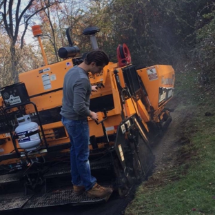 Roadmaster Paving and Sealcoating LLC - Brookfield, CT. 4 th generation son and grandson Mark Stanley runnin the paver . They might look young but both brothers are dedicated to knowing every aspect of Paving .