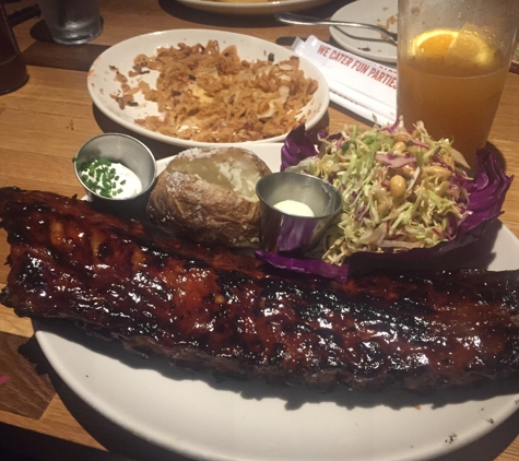 Wood Ranch BBQ & Grill - Burbank, CA. Full slab baby back with peanut coleslaw and baked potato