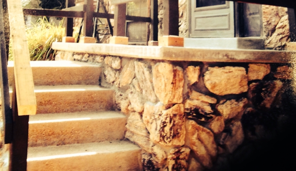 Hoffman Concrete, LLC - Saint Louis, MO. Front porch and steps with stone facia installed
