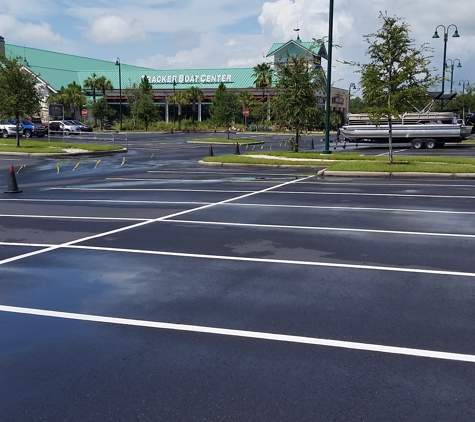 A-1 Parking Lot Renewal, Inc.. Re-stripe over sealcoat. Clean and fresh.