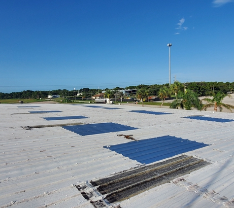 JT Roofing & Maintenance Inc. - Melbourne, FL. Replacing R-metal panels Ups Distribution center