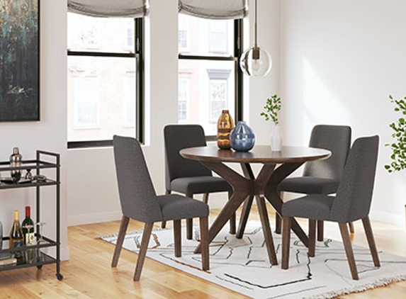 Interior Furniture Resources - Harrisburg, PA. Ashley D615 Round Dining Table with Dining Chairs