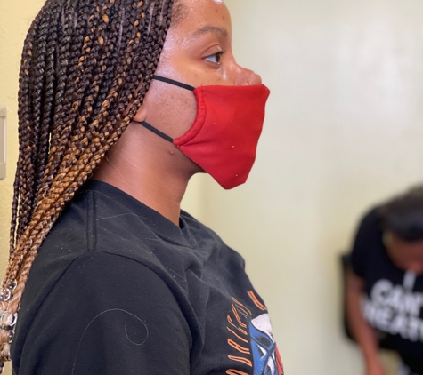 Astou inside The New Afrogenix Braiding Salon - Dallas, TX. Afrogenx Braids is the best salon for all African hairstyles in Dallas Fort Worth, Texas.