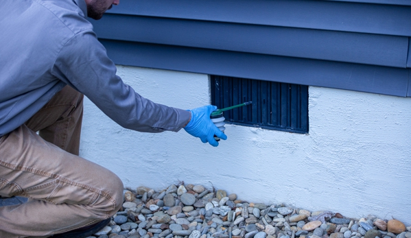 Stonewall Pest Control - Inman, SC. Dusting crawlspace vents to battle those pesky spiders and other creepy crawlies that live under your home and in other cracks/voids.