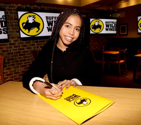 Buffalo Wild Wings - Novi, MI. My granddaughter after eating thai curry