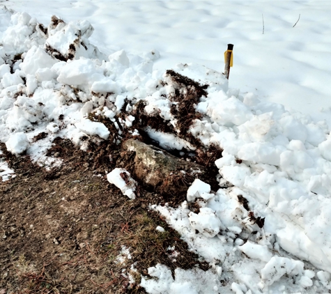 W.R. Reese Jr. Landscaping & Excavating - Gouldsboro, PA. He hit this corner stone so hard he dislodged it with a marker less than a foot away. Please tell him to stay farther away.