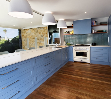 Qbic Living - Parkside, SA. Kitchen with stone bench servery & floating timber veneer shelves