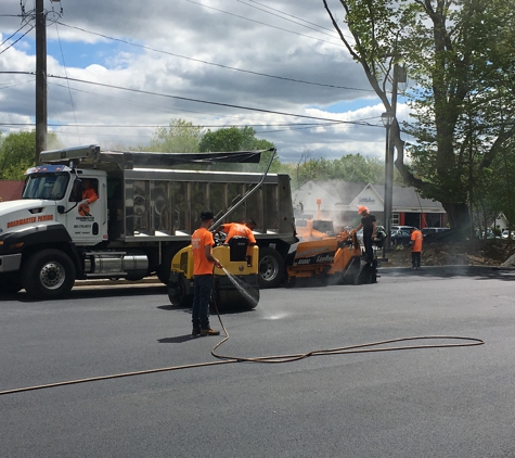 Roadmaster Paving and Sealcoating LLC - Brookfield, CT. Roadmaster Paving applying second course of asphalt on this new construction parking lot