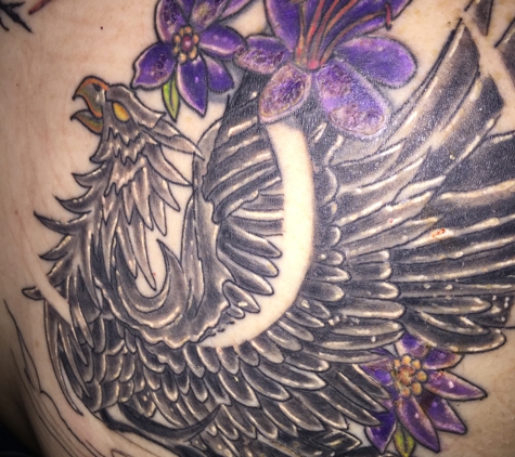 Tattoo Jungle - Calera, AL. 2nd sitting on my Phoenix.we now have tail feathers outlined, need to add colors to dragon w/flames & color Phoenix tail/cherry blossom tree