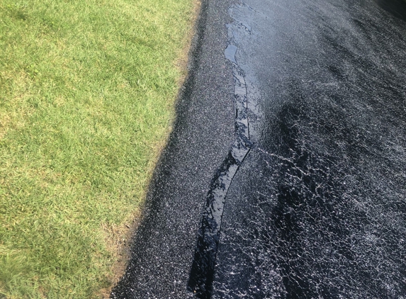 Ace Blacktop - York, PA. edge patched ,hot rubbered ,then sealed 