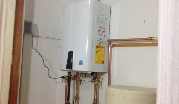 Holland Heating & Cooling - Davison, MI. White unit on wall is water heater. (Tan thing is for water softener )