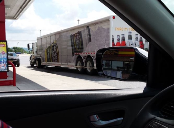 Ace Distributing - York, PA. Ace Transport (The Beer Ace)  hauling Mike's  Hard trailer.  Parked in mother with 2 babies, and 1 senior citizen in the heat and laughed.