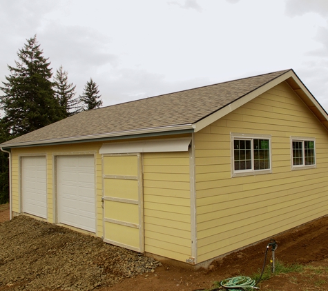 Black River Builders - Rochester, WA. 26x36 Garage with sliding barn door