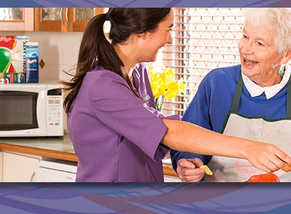 Amana Living - South Kalgoorlie, WA. A resident with her carer preparing food in the kitchen