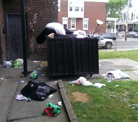 The Terrace Apartments - Philadelphia, PA. Trash everywhere except the dumpster...