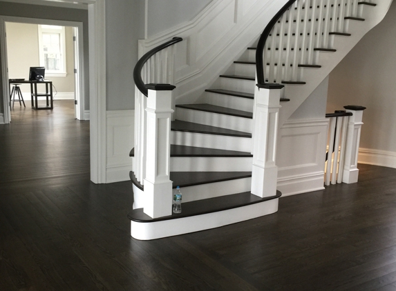 Artistic Floors Inc - Staten Island, NY. White oak plank floors finished to a dark walnut color and finished with Water base satin finish