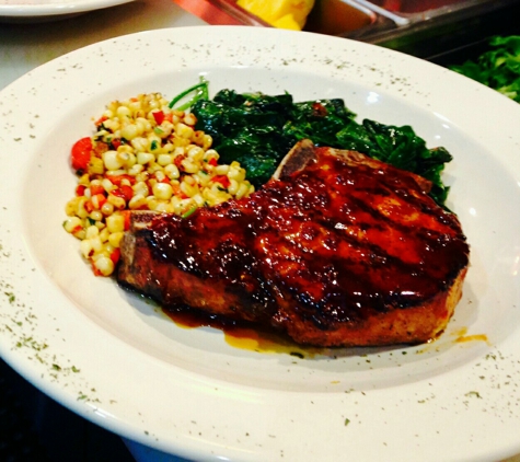 Humblebrags Eatery - Lakewood, CA. Pork chop ginger maple glaze with spinach and corn supper served from 5 pm to close