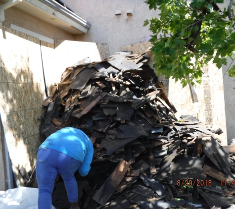 Sierra Roofing and Solar - Dublin, CA. All of the wood shake that was previously on the roof and now being bundled together for transportation.