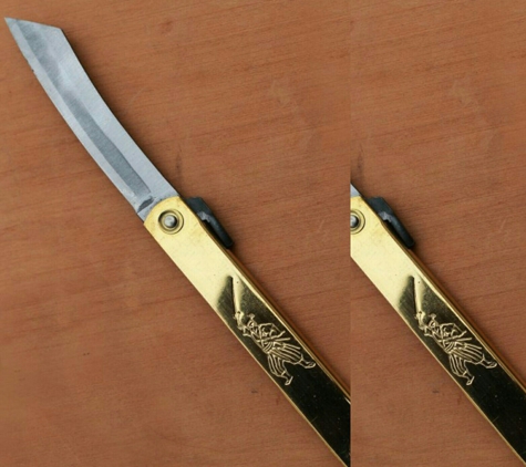 East to West Shoppe - Alameda, CA. Brass Folding knife with samurai etching. Great gift.