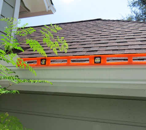 Heritage Painting and Contracting - Spring, TX. This is Robert's gutter installation. With the downspout to the right, the slope is incorrectly done.