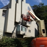 Painting Services of West Michigan - Spring Lake, MI. Scissors lift for painting residential exterior in West Michigan