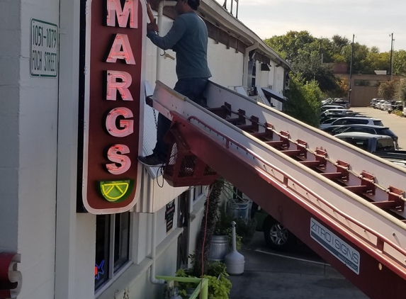 Zitro Signs - Irving, TX. Zitro Signs installing Neon sign.