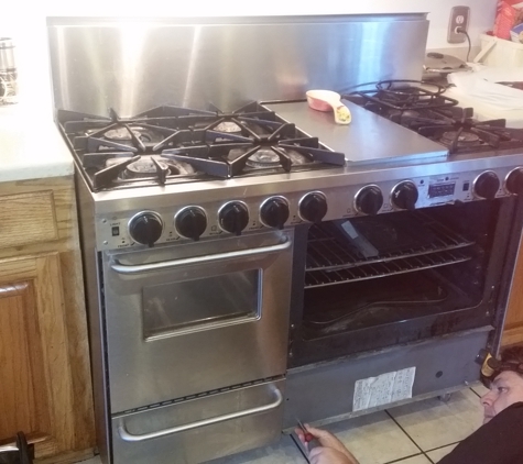 McComb Appliance Repair - Liberty, MS. working on gas oven