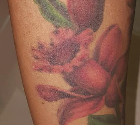 Baby Dolls Tattoos - Taylor, MI. Portions of some of the flowers around my right forearm done by Gabby