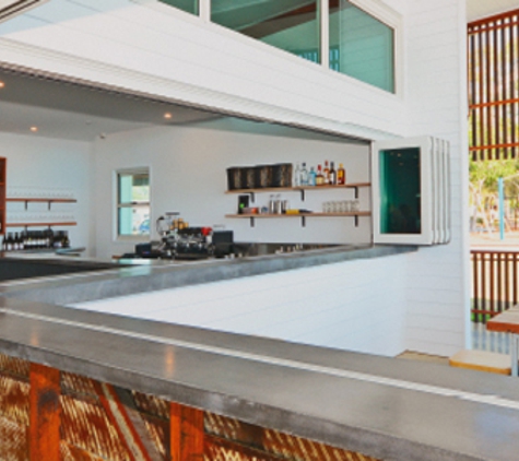 Bradnam's Windows & Doors - Ashmore, QLD. White Aluminium Bi-fold Windows