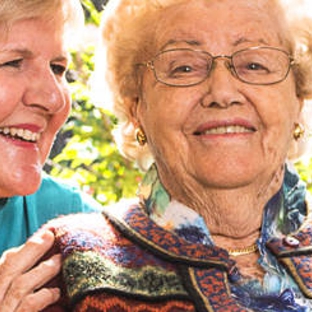 Amana Living Treendale - Australind, WA. A resistent with her carer outdoors