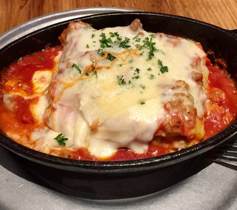 Nonna's Italian Bistro - Centennial, CO. A monster serving of the lasagna bolognese with such a tangy & flavorful red sauce with a kiss is red pepper flakes that complement the melted cheese.