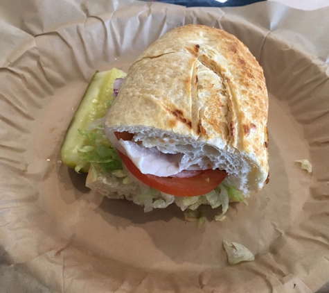 Sourdough & Co.-Roseville, CA - Roseville, CA. Half of a Garlic Pesto Turkey. Presentation a little lacking but the sandwich is yummy!