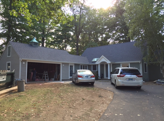 Elevate Management Group, LLC - W Hartford, CT. Brand new roof, 8' extension on garage for a mudroom, and new overhang/roof over front doorway.