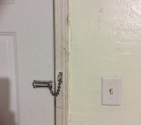 Budget Inn & Suites - Colby, KS. Wall, door and lock have obviously not been well maintained and are very dirty