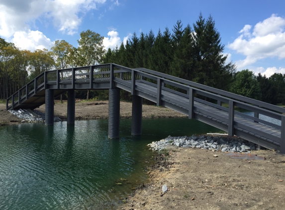 Lakes Ponds and Repairs - Quincy, IN. Canal connecting two lakes with walking bridge.