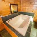 Log Cabin Lodge and Suites - Motels