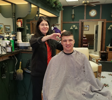 Sandy's Barber Shop - Pittsford, NY. Lisa the barber giving Matt a high and tight haircut.