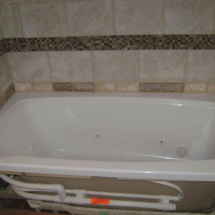 J & I FLOORING LLC - Neotsu, OR. Decorative tub surrounds and shower wall